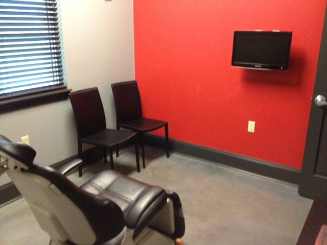 waiting room with chairs and a television